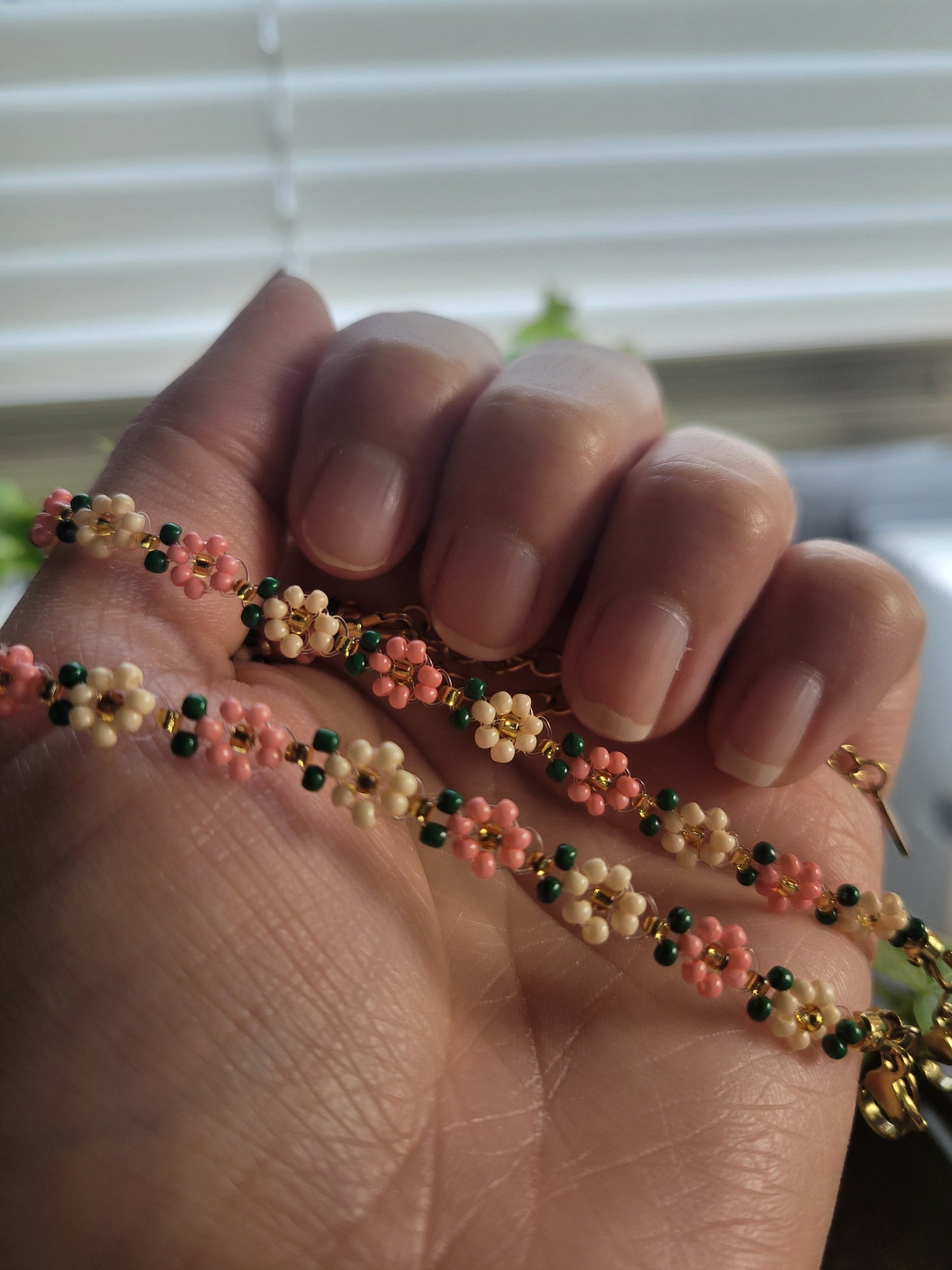Stainless steel glass beaded flower bracelet.
