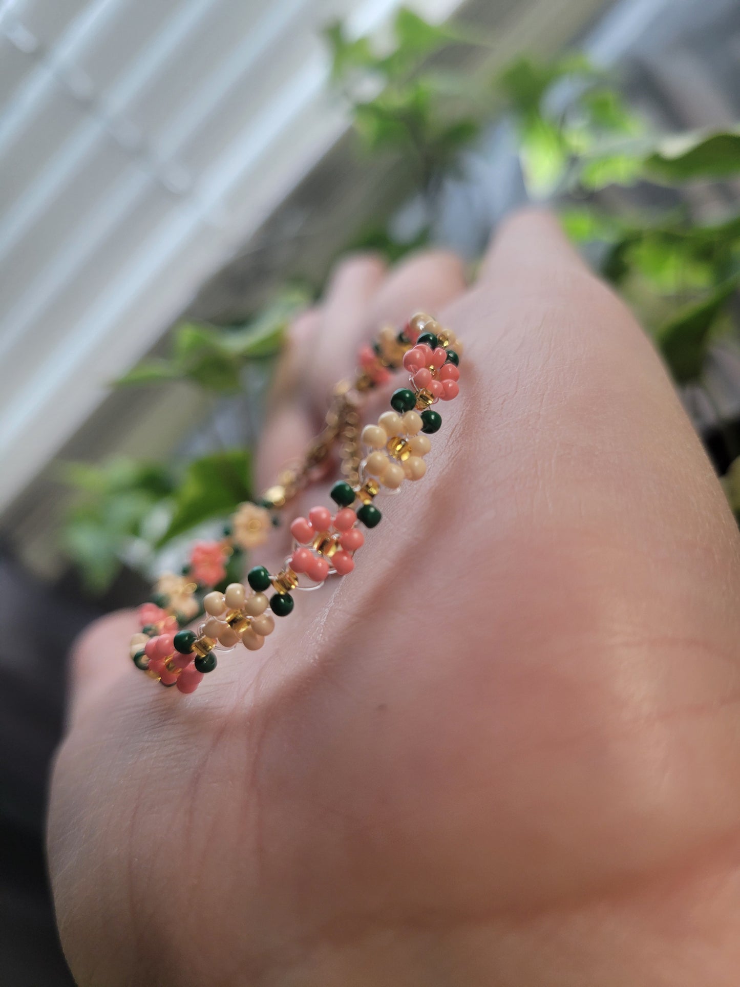 Stainless steel glass beaded flower bracelet.