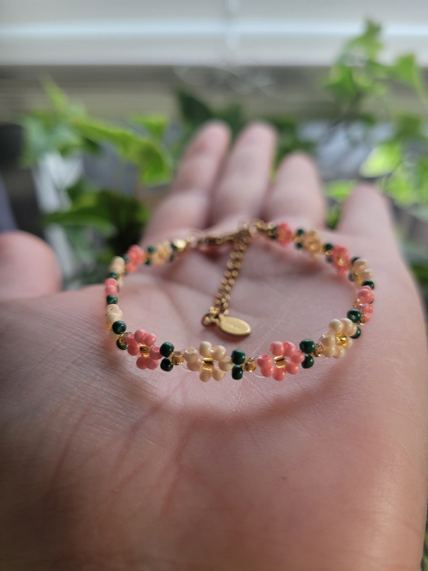 Stainless steel glass beaded flower bracelet.