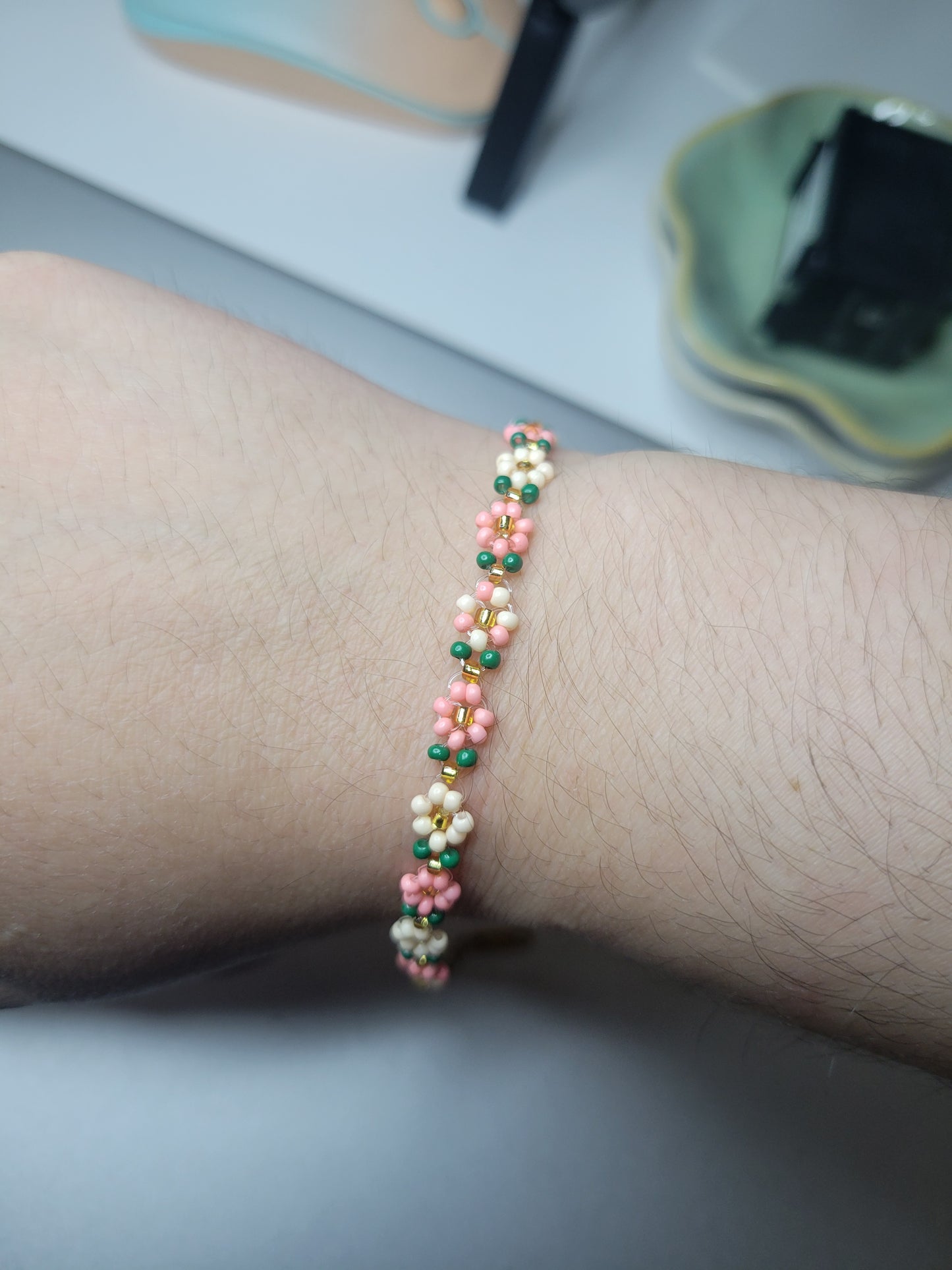 Stainless steel glass beaded flower bracelet.
