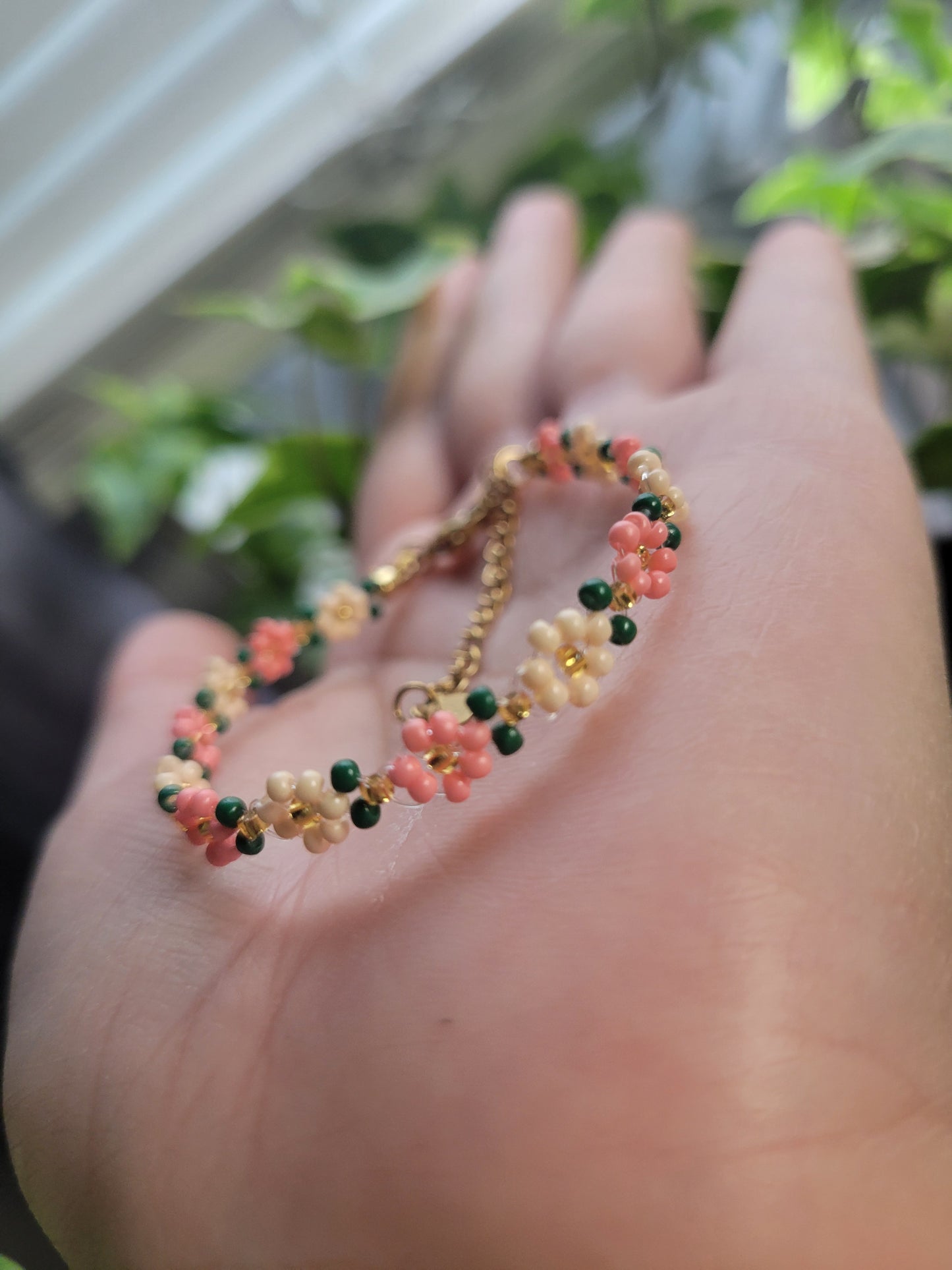 Stainless steel glass beaded flower bracelet.