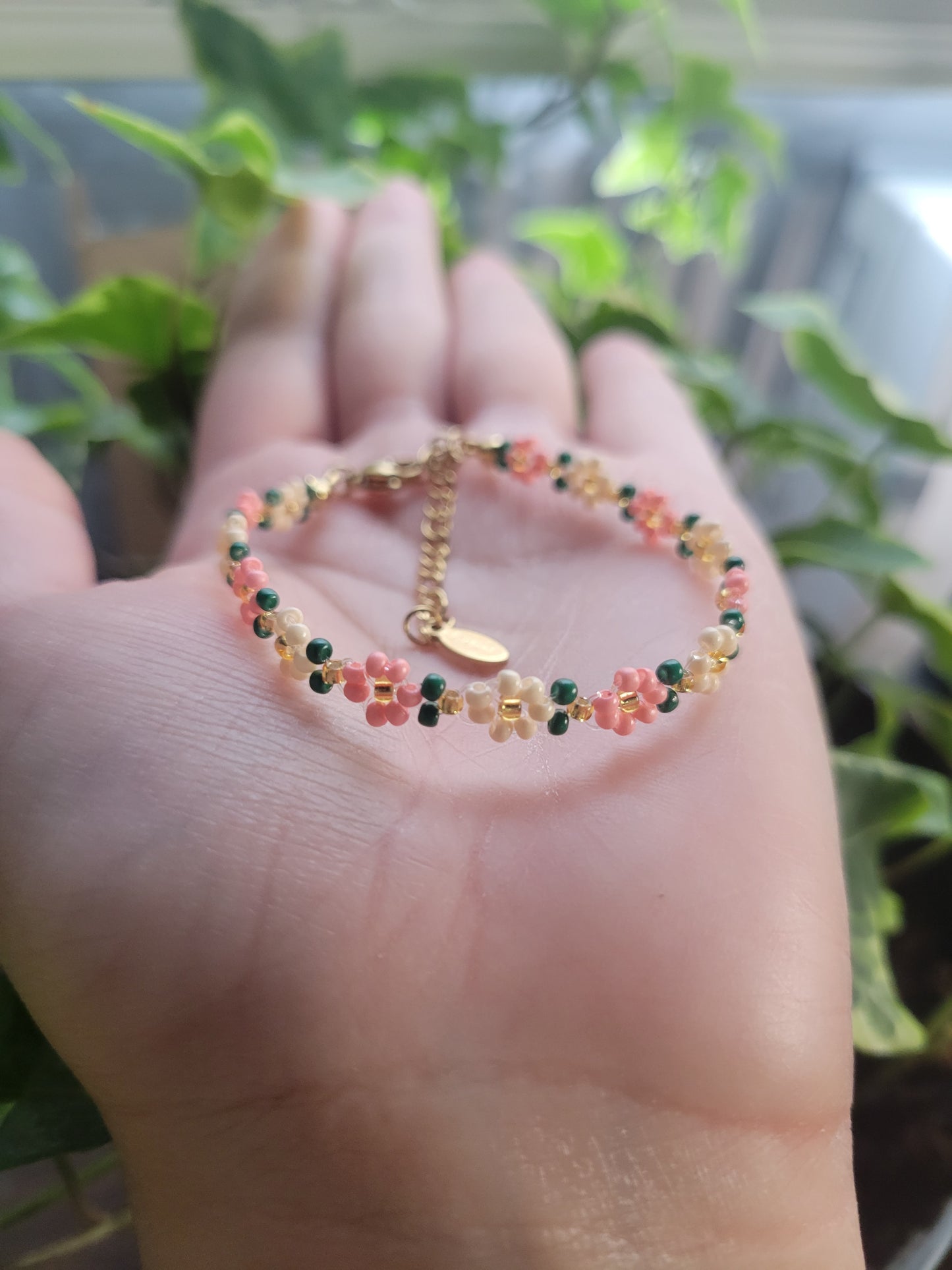 Stainless steel glass beaded flower bracelet.