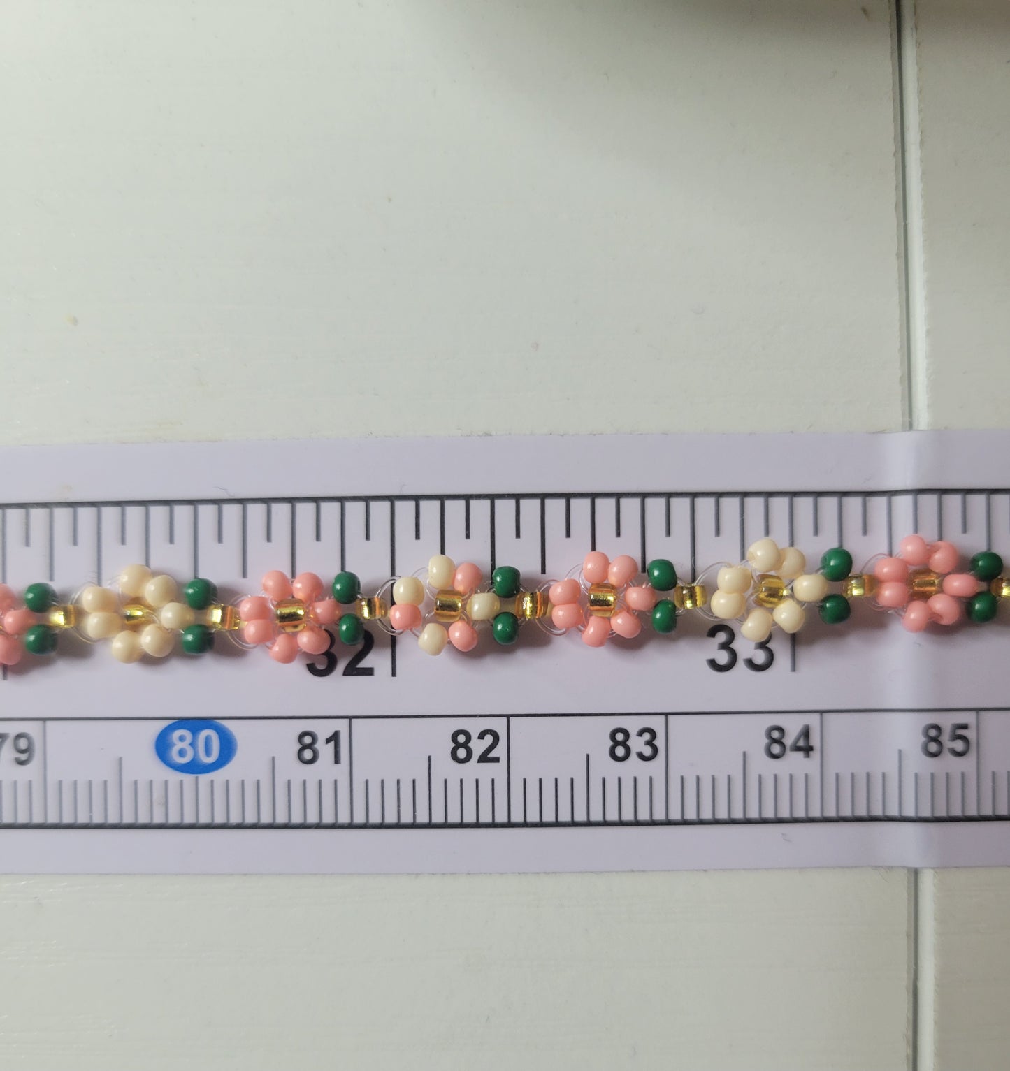 Stainless steel glass beaded flower bracelet.