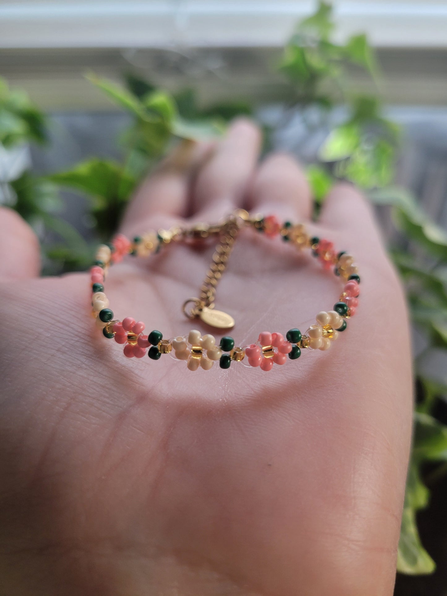 Stainless steel glass beaded flower bracelet.