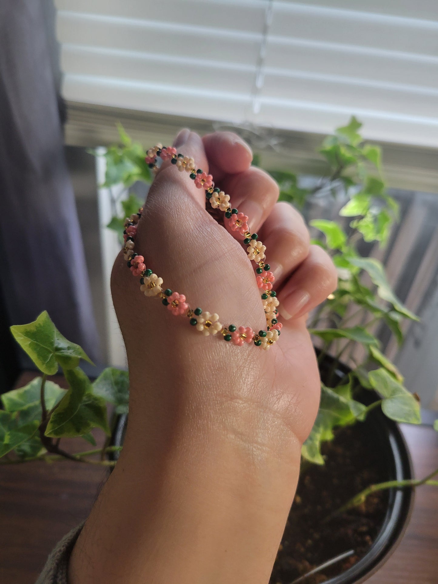 Stainless steel glass beaded flower bracelet.