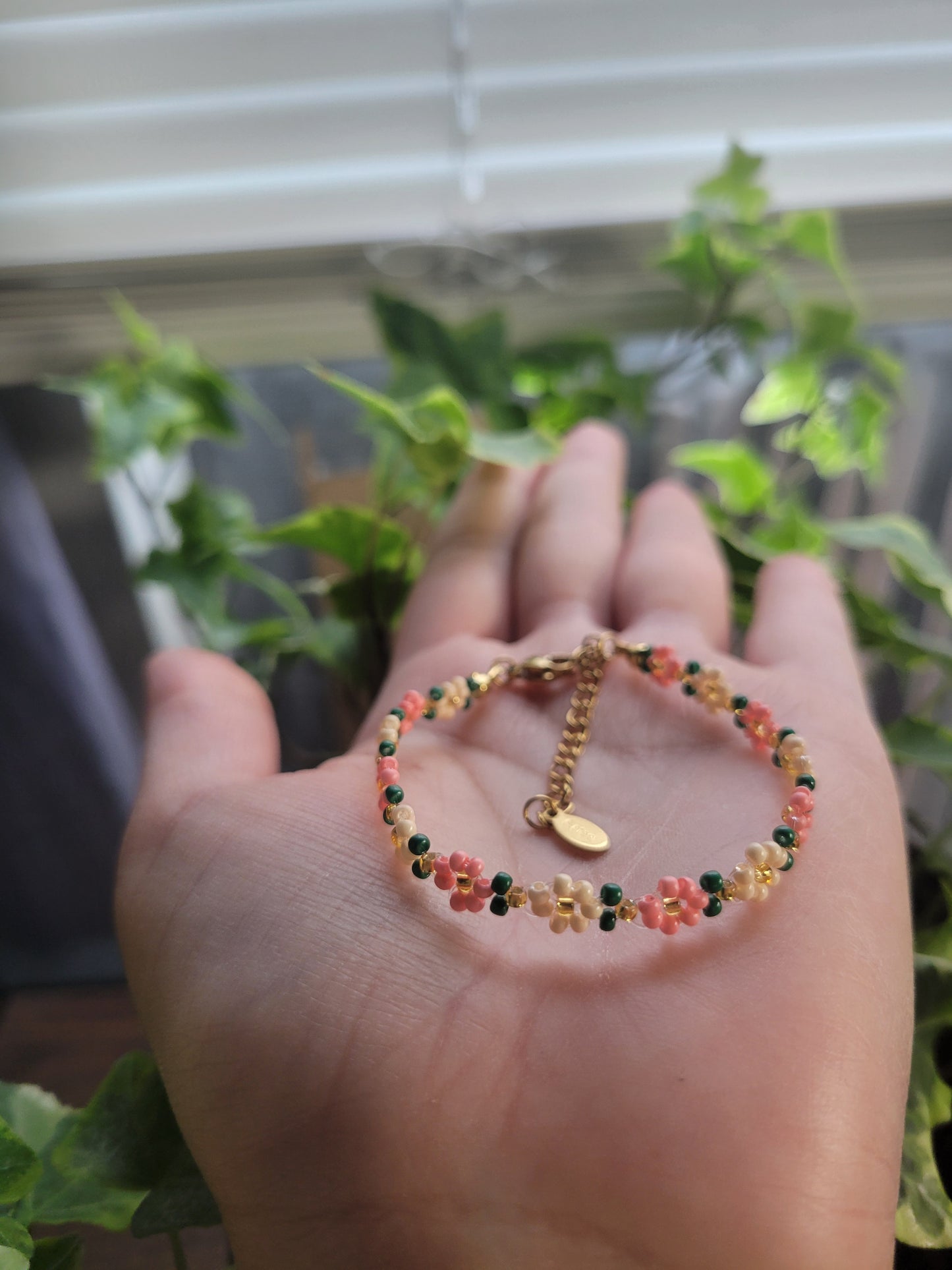 Stainless steel glass beaded flower bracelet.
